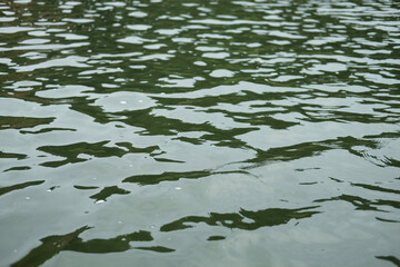 Destination of Beautiful Silhouette and twilight of sunset Reflected light on the river surface and glittering waves in the River. water background