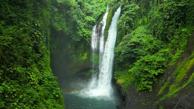 Aerial drone view of beautiful Aling Aling waterfall in nothern Bali, Indonesia.