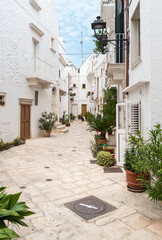 Fototapeta na wymiar Characteristic streets in the Locorotondo, metropolitan city of Bari, in Puglia, Italy