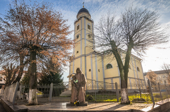 MUKACHEVO. UKRAINE - 10.12.2023 Cathedral of the Assumption of the Blessed Virgin Mary in Mukachevo. Ukraine. Statue of Mary and Jesus next to the cathedral.