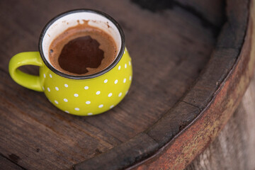 Vintage cup of coffee on wooden barrel