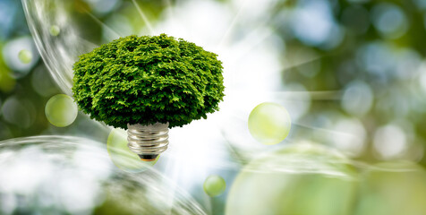 Abstract image of a tree crown and a light bulb base attached to it, forming a hybrid of a tree and...