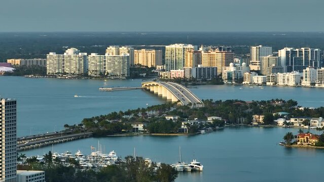 Aerial view of Sarasota city downtown with Ringling Bridge and high-rise office buildings on horizon. Real estate development in Florida. USA travel destination