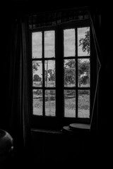 black and white window in the dark
