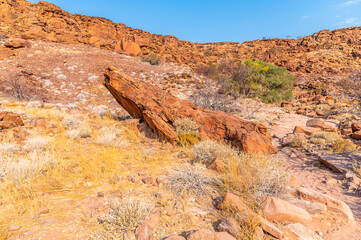 A view of large boulders at the entrance to the river valley at Twyfelfontein in Namibia during the dry season