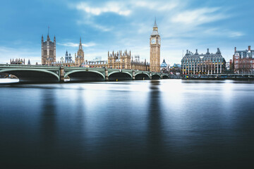 Fototapeta na wymiar Daytime London skyline featuring Westminster Bridge, the Big Ben, and other iconic landmarks against a backdrop of blue sky. Explore the beauty of Westminster in London.