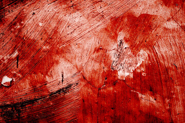 Red wall scratches which can be used as a horror background. Old shabby blood paint and plaster cracks