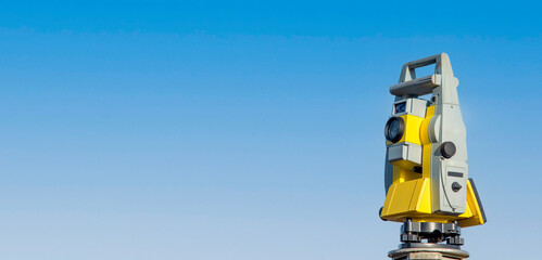 Close-up of electronic surveying equipment  tacheometer or theodolite on construction site with...