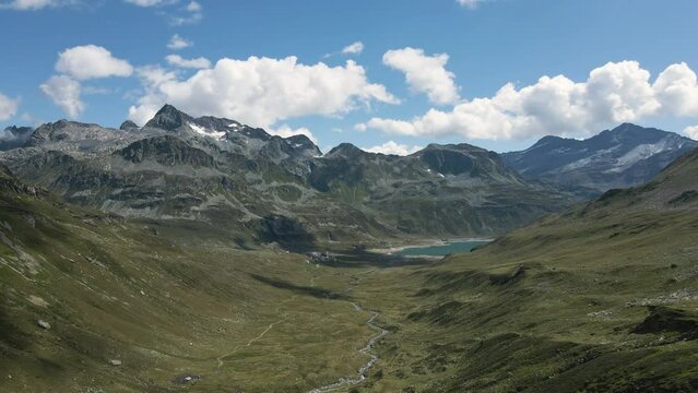 Aerial view of Val Loga - Zooming out from Montespluga Lake Town and Pizzo Suretta