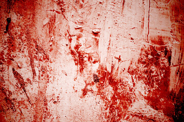 Red wall scratches which can be used as a horror background. Old shabby blood paint and plaster cracks