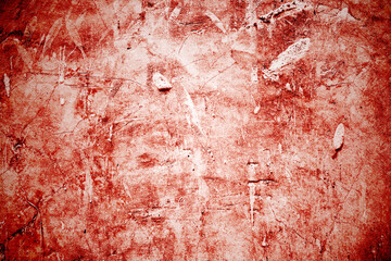 Red wall scratches which can be used as a horror background. Old shabby blood paint and plaster cracks