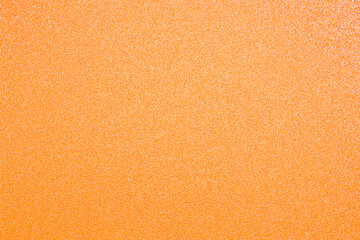 Orange golden glitter texture abstract banner background with space. Twinkling glow stars effect....