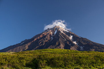 Naklejka na ściany i meble view of the peaks of the Koryak volcano