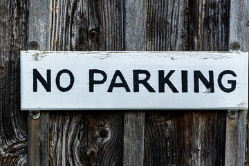 No parking sign on the old wooden door