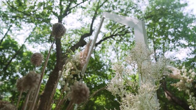 Boho wedding arch on the forest. Wedding decor created by a talanted florist 