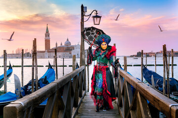 Carnevale di Venezia,Carneval .San Giorgio Maggiore  in the background,.costumes,.Venice,Veneto,Italy,Europe, - obrazy, fototapety, plakaty
