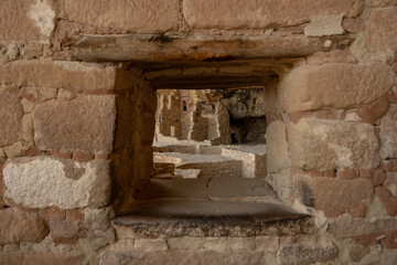 Looking Through Window Into Common Area of Balcony House