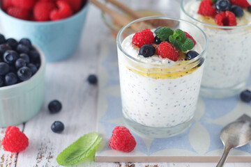 Greek yogurt in glasses with berries and quinoa