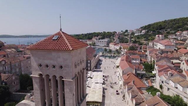 Aerial: Hvar, Croatia with Roman Catholic Diocese tower in the foreground