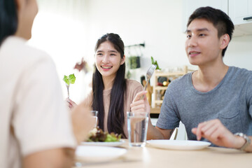 Happy Asian man and women enjoy having a launch together. Group of Asian people have a launch.