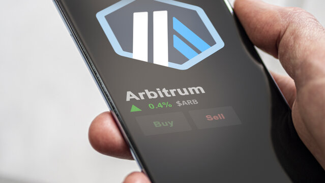 An investor analyzing the price of Arbitrum, the crypto $ARB broke out above the limit, ARB and climbs above the price.