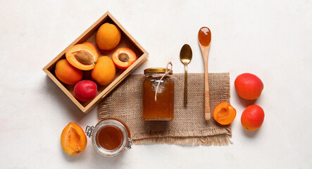 Composition with sweet apricot jam on white background, flat lay