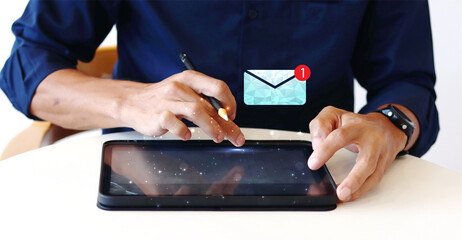 Email communication and digital marketing concept. Hand of businessman using ipad for admit email that has notification alert.