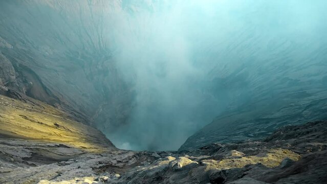 Video of the steaming active volcano crater of the Bromo on the Java island