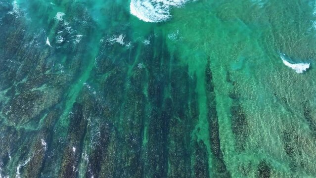 Colors and rock formations of El Sable beach. Coastal landscape in the town of Tagle. Aerial view from a drone. Suances Municipality. Cantabrian Sea. Cantabria. Spain. Europe