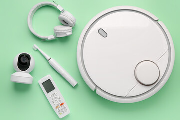 Modern gadgets on green background