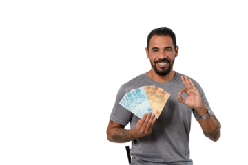 Man with Brazilian money makes "okey" sign