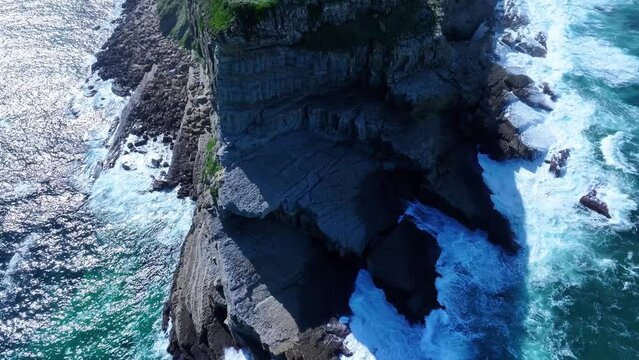 Coastal landscape in Punta Ballota. Sea cliffs near the town of Tagle. Aerial view from a drone. Suances Municipality. Cantabrian Sea. Cantabria. Spain. Europe