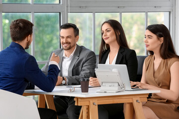 Human resources commission interviewing male applicant in office