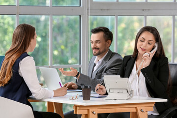 Human resources commission interviewing female applicant in office