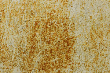 Metal surface with old damaged paint and rust.