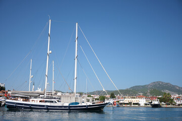Fototapeta premium Yachts at the pier near the lighthouse.