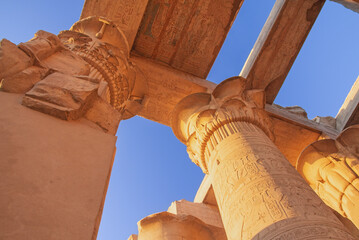 Columns at the Temples of Karnak.  Blue sky in the background. Luxor, Egypt.