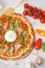 Tasty pizza with Burrata cheese on light background