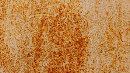 Metal surface with old damaged paint and rust.
