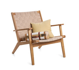 Wicker armchair with cushions and suitcase isolated on white background