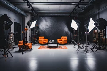 Fotobehang Interior of modern photo studio with orange armchairs and lighting equipment, Interior of modern photo studio with professional equipment, AI Generated © Iftikhar alam