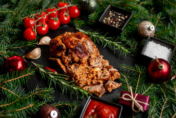 Christmas pork cooked in the oven against the background of a Christmas tree and Christmas toys