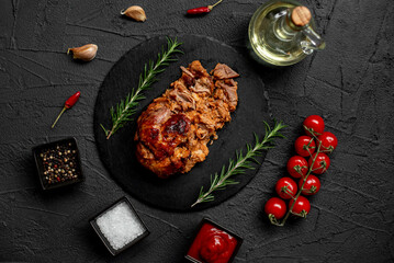 pork cooked in the oven on a stone background