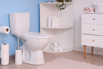 Fototapeta na wymiar White toilet bowl in interior of restroom