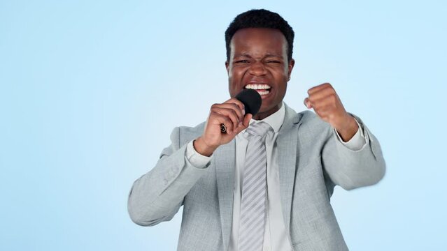 Black man, microphone and sport broadcast with cheers, excited journalist with success and fist pump on blue background. Game show commentator, hosting celebration and winner in media in studio