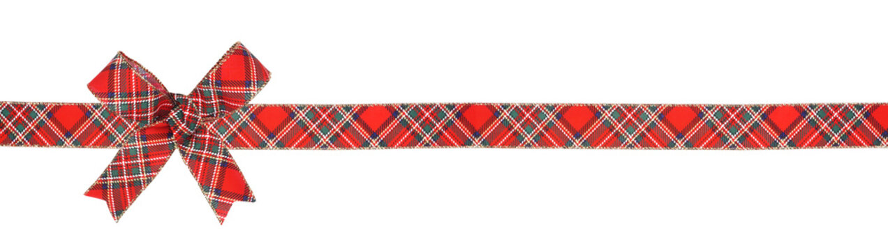 Red, green and white plaid Christmas gift bow and ribbon. Long border isolated on a white background.