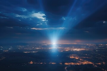 Naklejka na ściany i meble Air Drone Captures Cloudscape And Sunbeams From Above City At Night Captured By Aerial Drone Photography