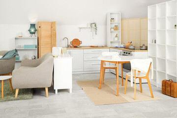 Interior of kitchen with dining table and counters
