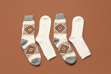 Warm socks on brown background