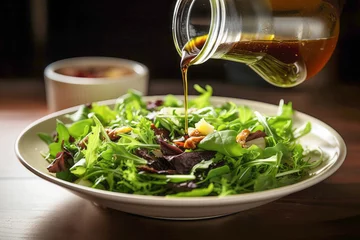 Foto auf Acrylglas A vegetarian salad with a mix of leafy greens, red tomatoes, and black olives, topped with a mouthwatering balsamic vinaigrette dressing. © EdNurg